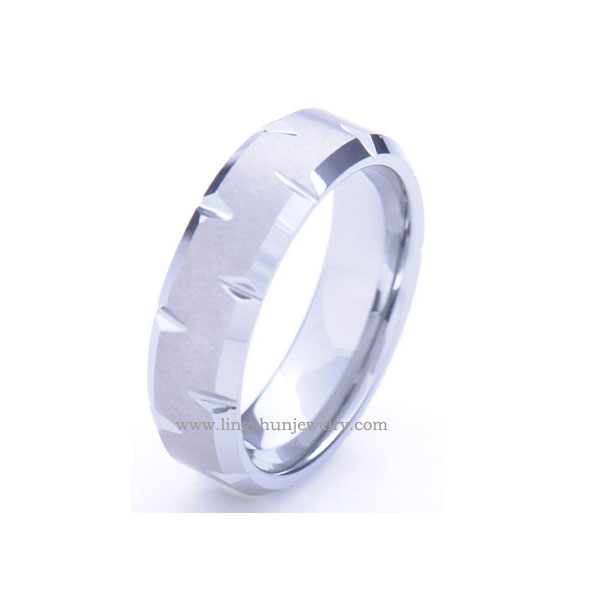 Tungsten carbide ring with faceted center, and step edges, Mirror high polish.Comfort fit.